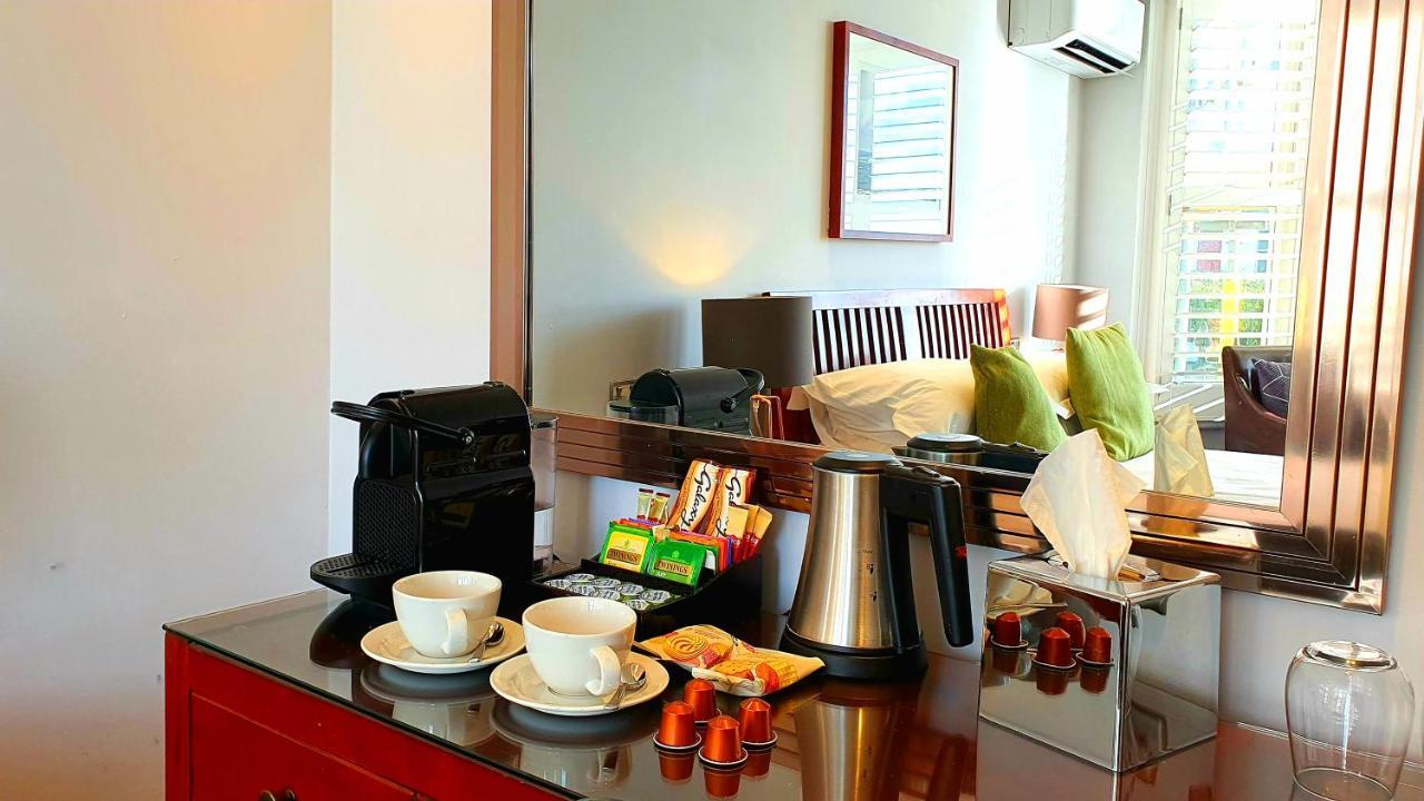 A Room With A View Брайтонн Экстерьер фото A Nespresso machine in a hotel room
